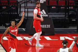 Jusuf Nurkic holds his right wrist during the match against Indiana Pacers.